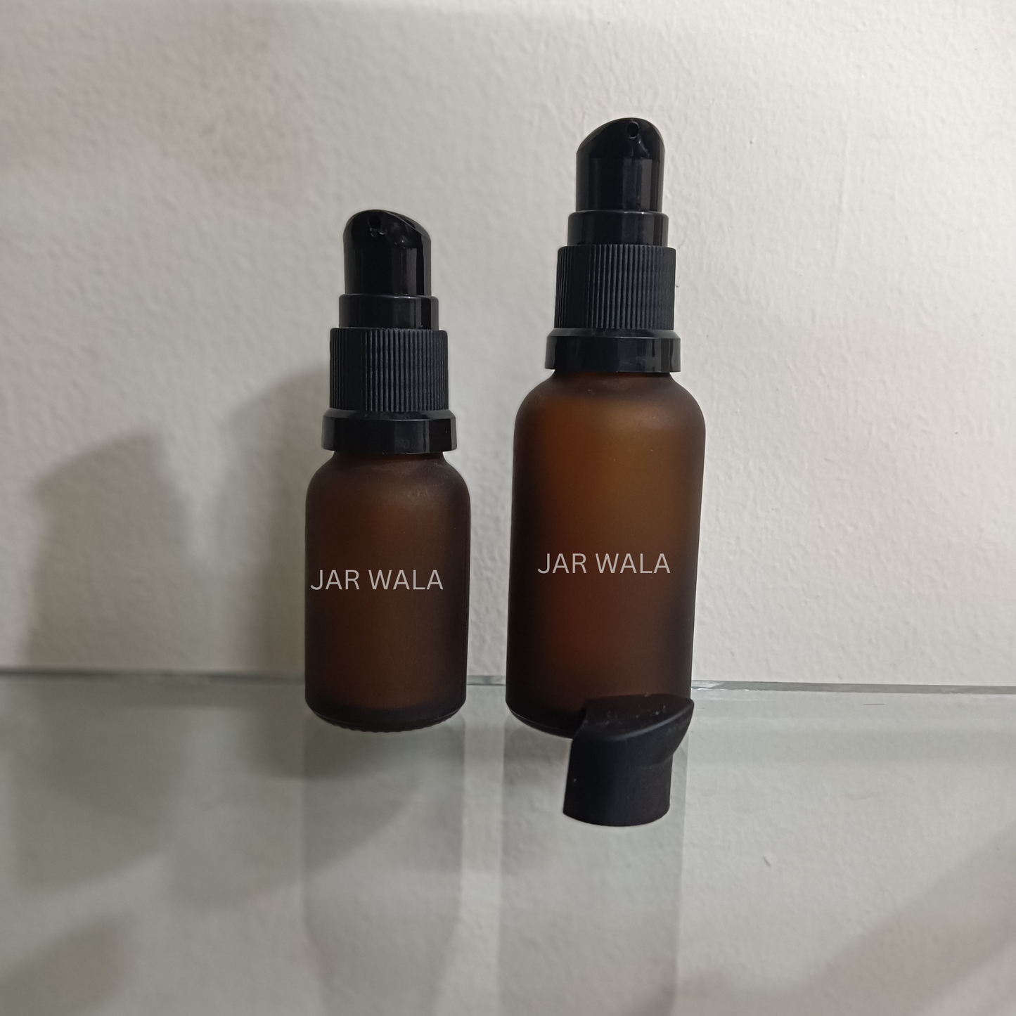 AMBER FROSTED GLASS BOTTLE WITH BLACK SERUM PUMP