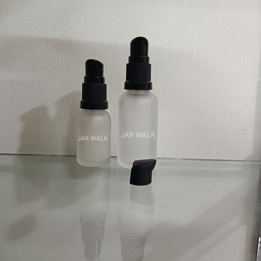 CLEAR FROSTED GLASS BOTTLE WITH BLACK SERUM PUMP