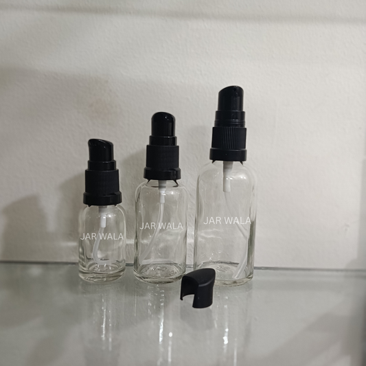 CLEAR GLASS BOTTLE WITH BLACK SERUM PUMP